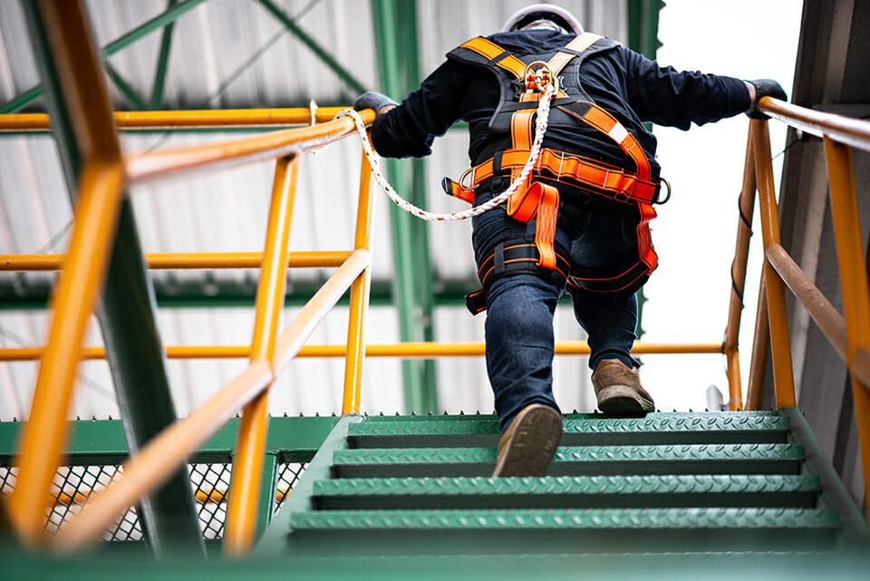 fall protection line attached to climbing employee